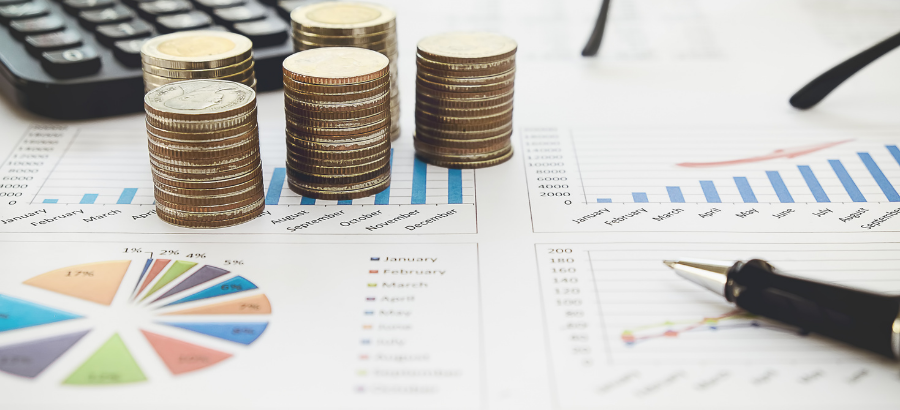Coins and charts on a table}